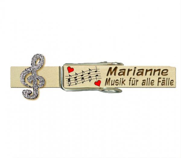 Wiesnglupperl mit einem silberfarbenen Notenschlüssel