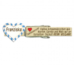 Glupperl mit einem kleinen weißen Volksfestherz